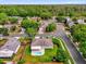 Aerial view of neighborhood shows wooded areas, mature trees, and in-ground pools at 1701 Smoketree Cir, Apopka, FL 32712