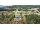 Aerial view of home nestled in a wooded lot on a quiet street at 17787 Sw 22Nd Ave, Ocala, FL 34473
