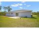 Spacious backyard featuring a serene outdoor area and an adjacent concrete patio at 17787 Sw 22Nd Ave, Ocala, FL 34473