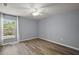Well-lit bedroom with ceiling fan and wood-look flooring at 17787 Sw 22Nd Ave, Ocala, FL 34473
