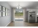 Dining area with sliding glass doors and stainless steel refrigerator at 17787 Sw 22Nd Ave, Ocala, FL 34473