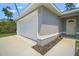 Close up of the home's garage door, showing the home's lovely exterior, landscaping and driveway at 17787 Sw 22Nd Ave, Ocala, FL 34473