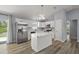 Well-lit kitchen with stainless steel appliances and a kitchen island at 17787 Sw 22Nd Ave, Ocala, FL 34473