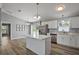 Kitchen featuring stainless steel appliances, stone countertops, and an island at 17787 Sw 22Nd Ave, Ocala, FL 34473