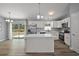Modern kitchen featuring stainless steel appliances, a kitchen island with stone countertops at 17787 Sw 22Nd Ave, Ocala, FL 34473