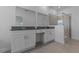 This bathroom features a dual vanity with sinks and a glass enclosed shower at 1908 Blissful Dr, Kissimmee, FL 34744