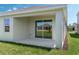 Covered patio with sliding glass doors, offering a seamless indoor-outdoor living experience at 1908 Blissful Dr, Kissimmee, FL 34744