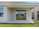 Covered patio with sliding glass doors, offering a seamless indoor-outdoor living experience at 1908 Blissful Dr, Kissimmee, FL 34744