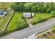 Overhead view of a home, large lot, and tree coverage near a road at 1981 N County Road 426, Oviedo, FL 32765