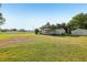 Expansive lot featuring a cozy home with a covered porch and a storage shed at 1981 N County Road 426, Oviedo, FL 32765