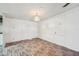 Bright living room with wood-look flooring and plenty of space for furniture at 1981 N County Road 426, Oviedo, FL 32765