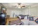 Well-appointed main bedroom with a ceiling fan, couch, and ample closet space designed for relaxation and storage at 1981 N County Road 426, Oviedo, FL 32765