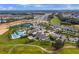An aerial view showing the community's pool, tennis courts, clubhouse, and scenic landscaping at 2026 Key Bay Trl, Kissimmee, FL 34747