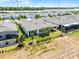 Aerial view showcasing backyard landscaping, patio areas, and proximity to neighboring houses at 2026 Key Bay Trl, Kissimmee, FL 34747