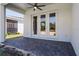 Covered patio with brick pavers, ceiling fan, and access to the house at 2026 Key Bay Trl, Kissimmee, FL 34747