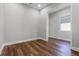 Neutral bedroom with hardwood floors, white trim and natural light at 2026 Key Bay Trl, Kissimmee, FL 34747