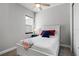 A cozy bedroom showcasing a ceiling fan, and a bright window at 2026 Key Bay Trl, Kissimmee, FL 34747
