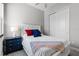 A cozy bedroom features a bed with a ceiling fan, side table and closet at 2026 Key Bay Trl, Kissimmee, FL 34747