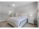 A well-lit bedroom features a bed with coordinated side tables. and ceiling fan at 2026 Key Bay Trl, Kissimmee, FL 34747