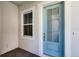 Exterior front door featuring glass panes and white trim at 2026 Key Bay Trl, Kissimmee, FL 34747