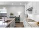 Modern kitchen with stainless appliances, white cabinets, granite countertops, and a gas cooktop at 2026 Key Bay Trl, Kissimmee, FL 34747