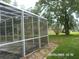 Spacious screened-in porch with a view of the backyard at 21708 Royal St Georges Ln, Leesburg, FL 34748