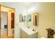 Bathroom with a vanity, mirrored cabinet, and tiled shower at 2729 Hilda Ct, Orlando, FL 32826