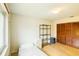 This bedroom offers laminate flooring, a window for light, louvred closet doors, and black shelving at 2729 Hilda Ct, Orlando, FL 32826