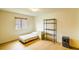 This bedroom offers laminate flooring, one window for light, and black shelving at 2729 Hilda Ct, Orlando, FL 32826