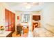 Bedroom features a desk, TV, closet, and bed, offering a functional space at 2729 Hilda Ct, Orlando, FL 32826