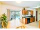 Eat-in kitchen with sliding doors offering pool views and ample counter space at 2729 Hilda Ct, Orlando, FL 32826