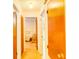 Hallway with access to bedrooms and a closet with wood-look doors at 2729 Hilda Ct, Orlando, FL 32826