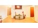 Bright living room with wood floors, modern TV, and a decorative glass table at 2729 Hilda Ct, Orlando, FL 32826