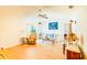 Sun-filled living room featuring hardwood floors and comfortable seating at 2729 Hilda Ct, Orlando, FL 32826