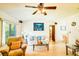 Bright living room with vaulted ceilings, hardwood floors, and picture window at 2729 Hilda Ct, Orlando, FL 32826