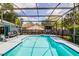 Sparkling screened-in pool and patio area, perfect for outdoor entertaining and relaxation at 2729 Hilda Ct, Orlando, FL 32826