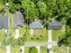 Aerial view of a home with a fenced backyard and mature landscaping at 275 W 4Th St, Chuluota, FL 32766