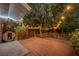 Backyard wooden deck, barrel sauna, and lush foliage with hanging string lights at 275 W 4Th St, Chuluota, FL 32766