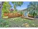 Backyard with wooden deck, barrel sauna, and lush foliage at 275 W 4Th St, Chuluota, FL 32766