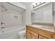 Beautiful bathroom with marble tiling in the tub/shower and granite countertops at 275 W 4Th St, Chuluota, FL 32766