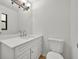 Bright bathroom with a modern vanity and updated fixtures at 275 W 4Th St, Chuluota, FL 32766