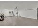 Spacious garage area with washer, dryer, utility sink, and overhead lighting at 275 W 4Th St, Chuluota, FL 32766