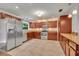 Spacious kitchen featuring stainless steel appliances and ample cabinet storage at 275 W 4Th St, Chuluota, FL 32766