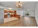 Open floor plan featuring a kitchen with a breakfast bar and dining area at 275 W 4Th St, Chuluota, FL 32766