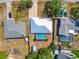 An overhead view of a home with a pool, shed and a firepit nestled within a fenced backyard at 2990 Mallard Dr, Deltona, FL 32738