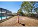 The backyard features a fire pit, mature trees, and a screened-in pool at 2990 Mallard Dr, Deltona, FL 32738