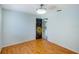 Bedroom featuring wood floors and a view into the home through a decorative door at 2990 Mallard Dr, Deltona, FL 32738