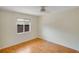 Comfortable bedroom featuring hardwood floors and ample natural light at 2990 Mallard Dr, Deltona, FL 32738
