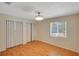 Bright bedroom with light walls, wood floors, and a window providing natural light at 2990 Mallard Dr, Deltona, FL 32738