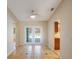 An open dining area features ceramic tile floors and access to the pool area through French doors at 2990 Mallard Dr, Deltona, FL 32738